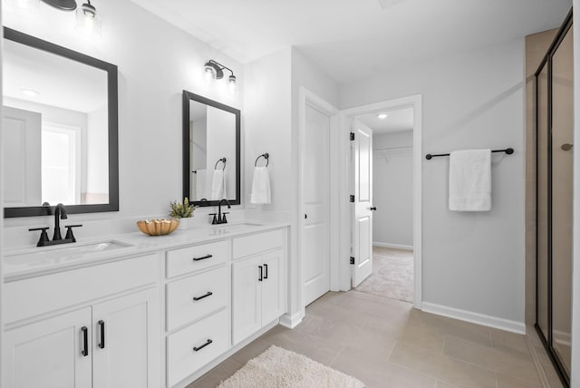 272 Kildeer Dr, Clarksville, TN 37040 - full bathroom featuring a stall shower, double vanity, a walk in closet, tile patterned flooring, and recessed lighting
