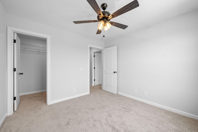 272 Kildeer Dr, Clarksville, TN 37040 - unfurnished bedroom with light carpet, baseboards, a spacious closet, a closet, and a ceiling fan