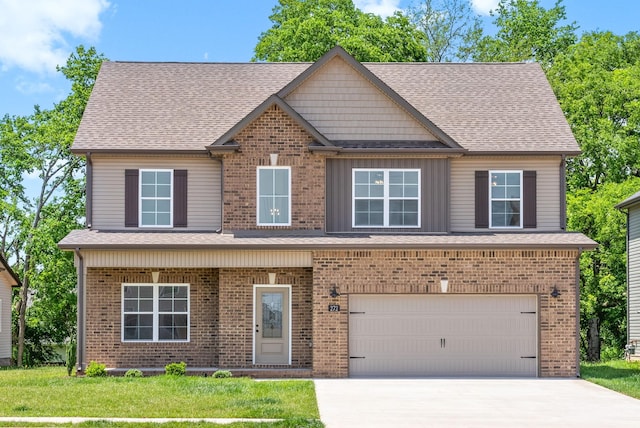 272 Kildeer Dr, Clarksville, TN 37040 - view of front facade featuring an attached garage, driveway, a shingled roof, and brick siding