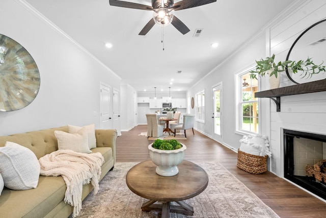 272 Kildeer Dr, Clarksville, TN 37040 - living room featuring ornamental molding, dark wood-style floors, ceiling fan, recessed lighting, and a fireplace
