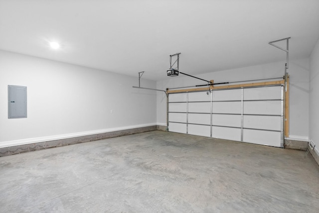 272 Kildeer Dr, Clarksville, TN 37040 - garage featuring electric panel, a garage door opener, and baseboards