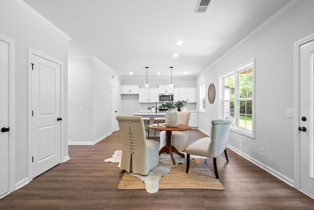 272 Kildeer Dr, Clarksville, TN 37040 - dining space featuring baseboards, dark wood-type flooring, recessed lighting, and crown molding