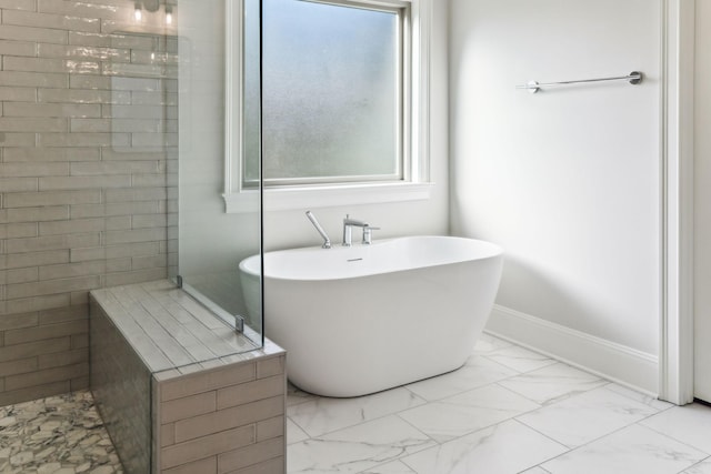 1611 Martha Washington Way, Murfreesboro, TN 37130 - bathroom featuring marble look tiles, a soaking tub, and tiled shower