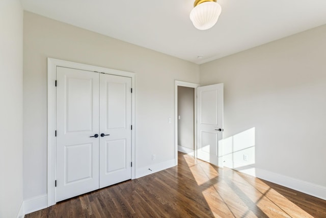 1611 Martha Washington Way, Murfreesboro, TN 37130 - unfurnished bedroom featuring wood finished floors, baseboards, and a closet