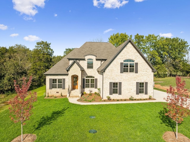 1611 Martha Washington Way, Murfreesboro, TN 37130 - french provincial home with a front lawn, a shingled roof, and brick siding