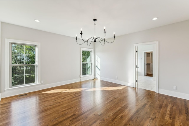 1611 Martha Washington Way, Murfreesboro, TN 37130 - unfurnished dining area with a chandelier, healthy amount of natural light, wood finished floors, baseboards, and recessed lighting