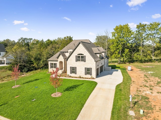 1611 Martha Washington Way, Murfreesboro, TN 37130 - french country inspired facade with driveway, a garage, a front yard, and brick siding