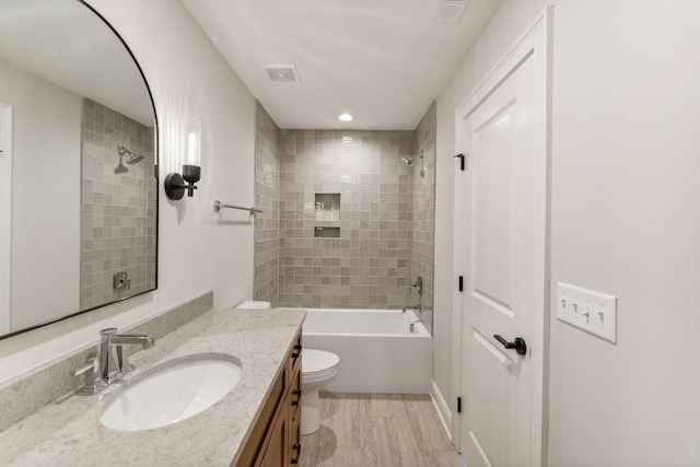 1611 Martha Washington Way, Murfreesboro, TN 37130 - bathroom with toilet, vanity, bathing tub / shower combination, recessed lighting, and wood finished floors