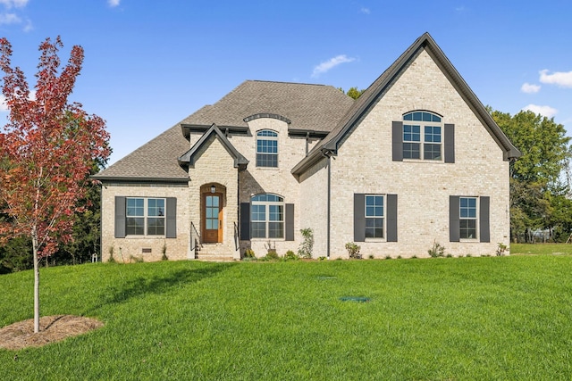 1611 Martha Washington Way, Murfreesboro, TN 37130 - french provincial home featuring a front yard, roof with shingles, and brick siding