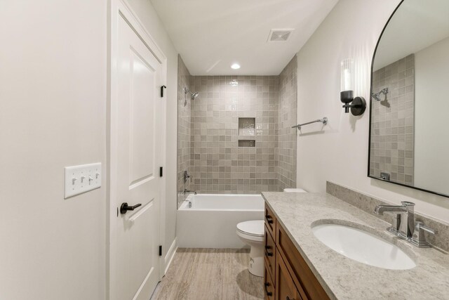 1611 Martha Washington Way, Murfreesboro, TN 37130 - full bathroom featuring toilet, wood finished floors, vanity, and bathing tub / shower combination
