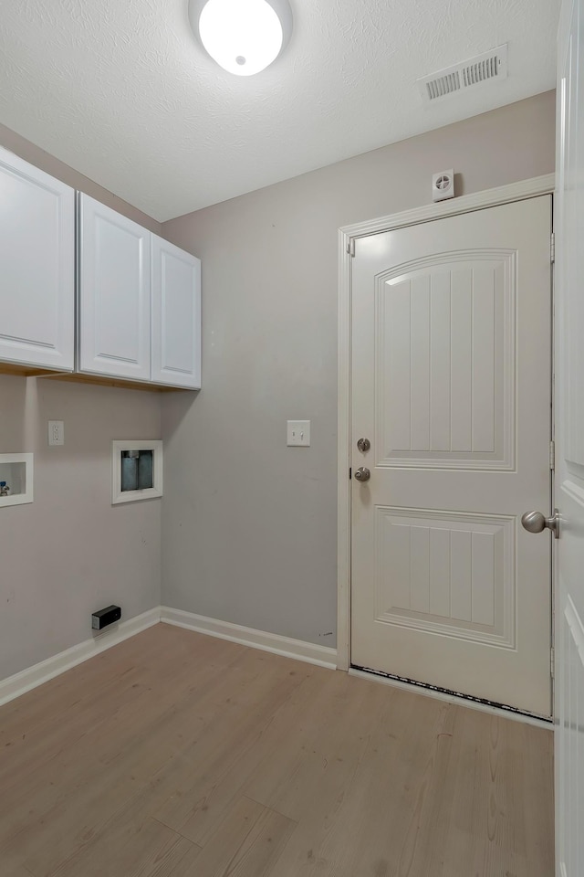 209 Bakerview St, Murfreesboro, TN 37129 - clothes washing area featuring hookup for a washing machine, cabinet space, light wood-style floors, and baseboards