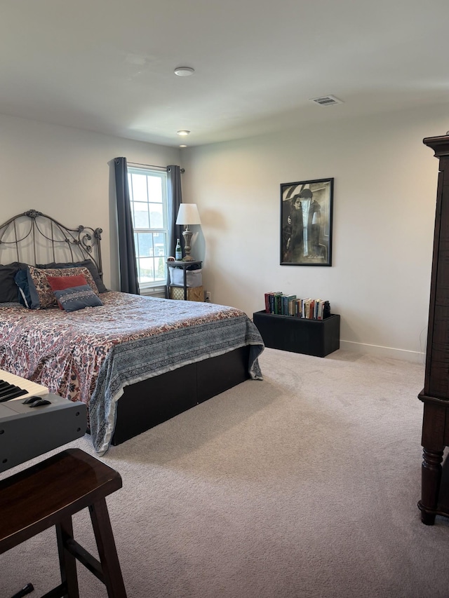 carpeted bedroom with baseboards