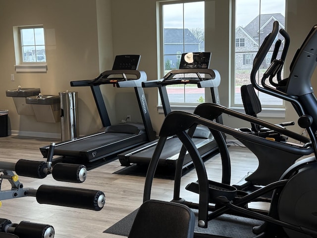 gym with wood finished floors and baseboards