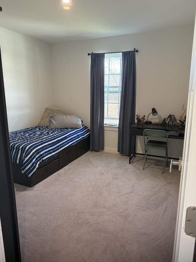bedroom featuring carpet flooring and baseboards