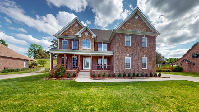 4050 Oak Pointe Dr, Pleasant View, TN 37146 - view of front of property with brick siding, a front yard, and a porch