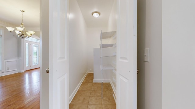 4050 Oak Pointe Dr, Pleasant View, TN 37146 - hall featuring a chandelier, crown molding, and baseboards