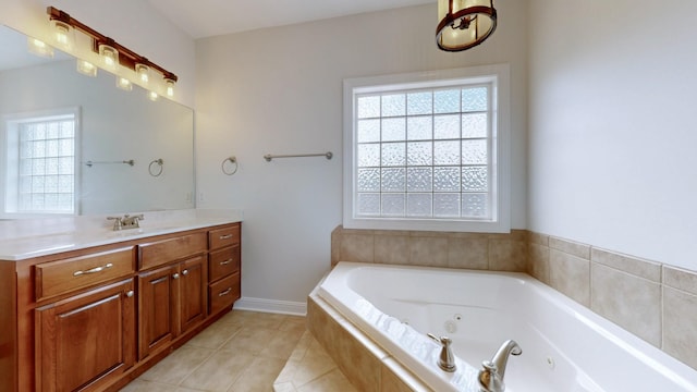 4050 Oak Pointe Dr, Pleasant View, TN 37146 - full bath featuring a jetted tub, vanity, and tile patterned floors