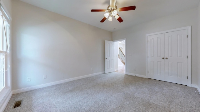 4050 Oak Pointe Dr, Pleasant View, TN 37146 - unfurnished bedroom with carpet, a closet, baseboards, and ceiling fan
