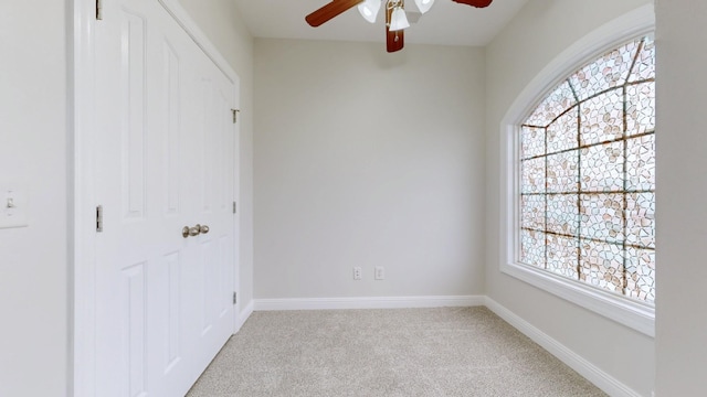 4050 Oak Pointe Dr, Pleasant View, TN 37146 - unfurnished bedroom with light carpet, baseboards, a closet, and ceiling fan