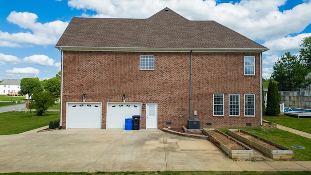 4050 Oak Pointe Dr, Pleasant View, TN 37146 - view of side of property featuring an attached garage, concrete driveway, crawl space, a yard, and brick siding
