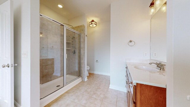 4050 Oak Pointe Dr, Pleasant View, TN 37146 - full bathroom with vanity, a shower stall, tile patterned floors, toilet, and baseboards