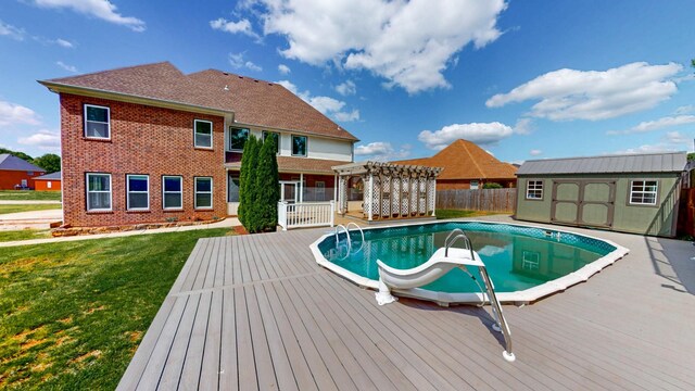 4050 Oak Pointe Dr, Pleasant View, TN 37146 - view of pool featuring a pergola, a wooden deck, a storage unit, and an outdoor structure