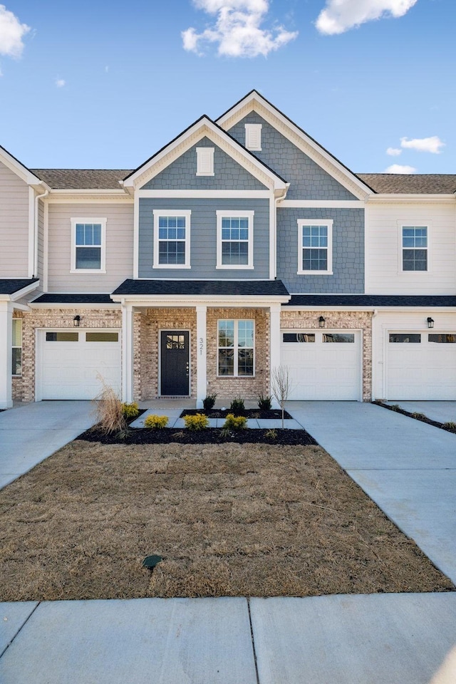 321 Carver Connection, Lebanon, TN 37087 - townhome / multi-family property with driveway, a garage, and a front yard