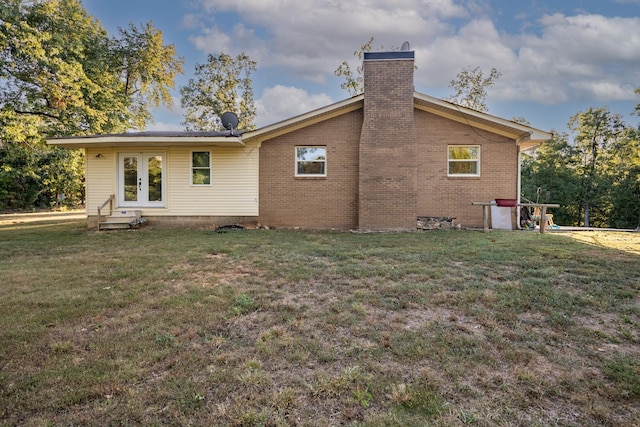 960 Knob Creek Rd, Lawrenceburg, TN 38464 - rear view of property with a chimney, a yard, french doors, and brick siding