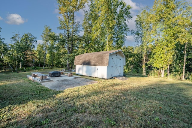 960 Knob Creek Rd, Lawrenceburg, TN 38464 - view of grassy yard featuring a storage unit, an outdoor structure, and a patio area