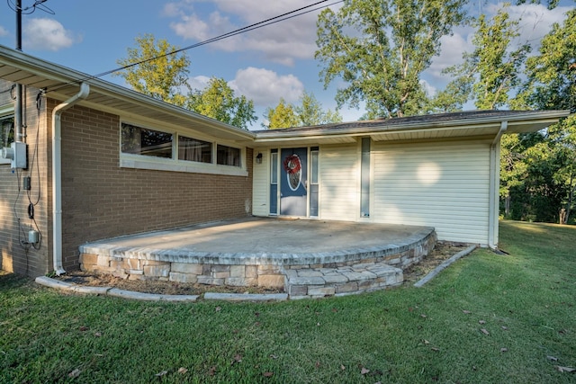 960 Knob Creek Rd, Lawrenceburg, TN 38464 - rear view of property with a lawn, a patio area, and brick siding