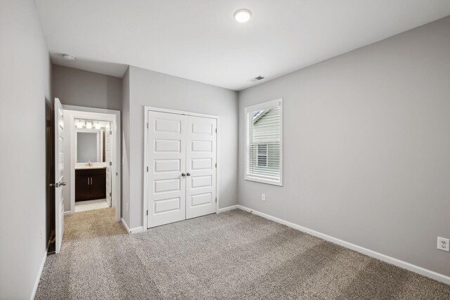 325 Carver Connection, Lebanon, TN 37087 - unfurnished bedroom featuring carpet flooring, a closet, baseboards, and a sink