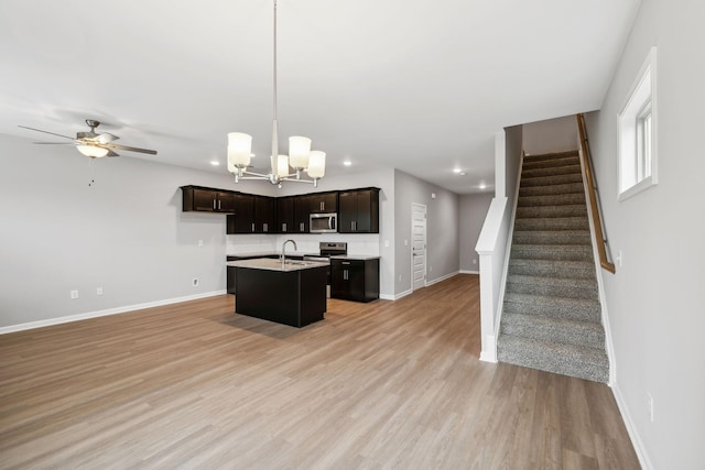 325 Carver Connection, Lebanon, TN 37087 - kitchen featuring appliances with stainless steel finishes, a sink, recessed lighting, a kitchen island with sink, and light countertops