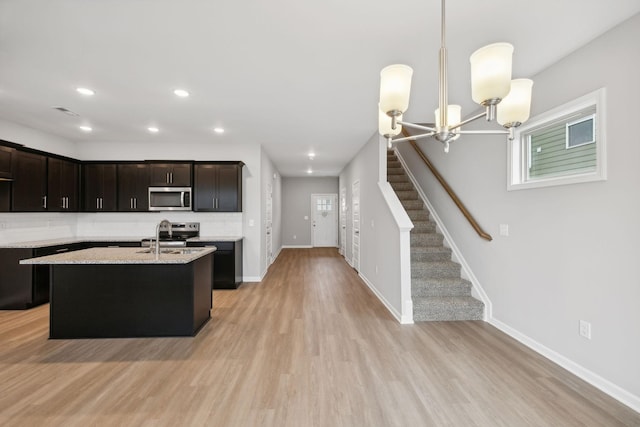 325 Carver Connection, Lebanon, TN 37087 - kitchen with stainless steel appliances, light wood-style floors, baseboards, pendant lighting, and recessed lighting