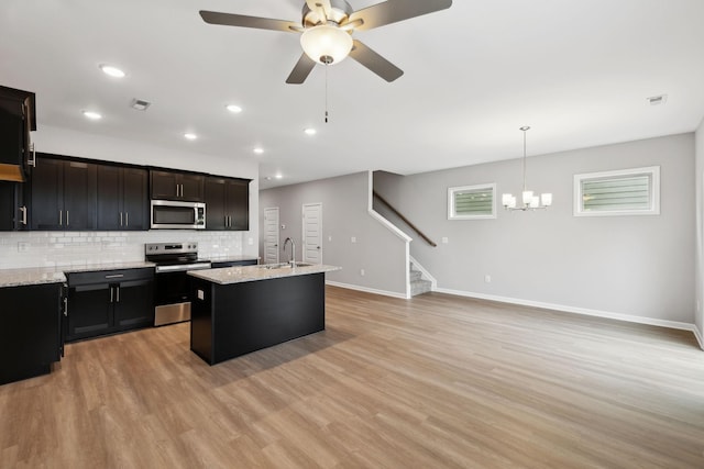 325 Carver Connection, Lebanon, TN 37087 - kitchen with stainless steel appliances, a sink, baseboards, backsplash, and a ceiling fan