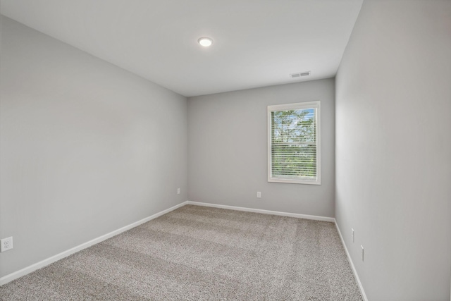 empty room with carpet flooring and baseboards