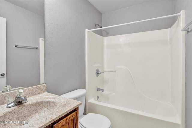 full bath with toilet, vanity, and shower / bath combination