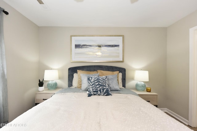 bedroom featuring baseboards