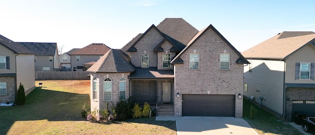 1408 Kingbird Dr, Clarksville, TN 37040 - view of front of property with brick siding, an attached garage, and concrete driveway
