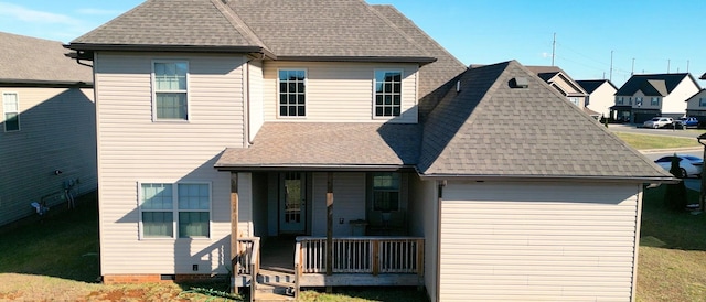 1408 Kingbird Dr, Clarksville, TN 37040 - view of front of house featuring covered porch, a shingled roof, a residential view, and a front lawn