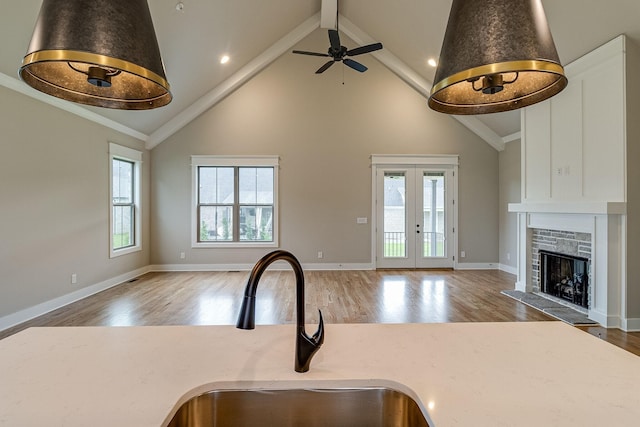 1022 Gadwall Ln, Spring Hill, TN 37174 - kitchen with open floor plan, a sink, wood finished floors, high vaulted ceiling, and beamed ceiling