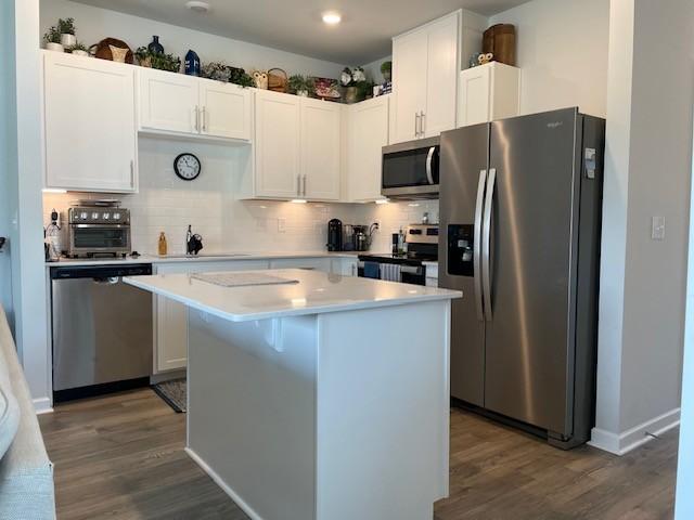 1401 Walker Way, Columbia, TN 38401 - kitchen featuring stainless steel appliances, a sink, a kitchen island, dark wood-style flooring, and recessed lighting