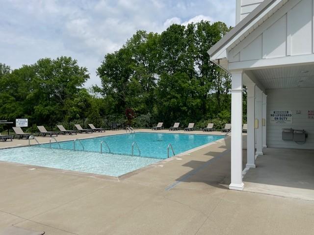 1401 Walker Way, Columbia, TN 38401 - community pool with a patio area and view of wooded area