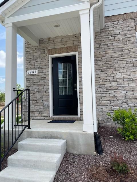 1401 Walker Way, Columbia, TN 38401 - view of exterior entry with stone siding and covered porch