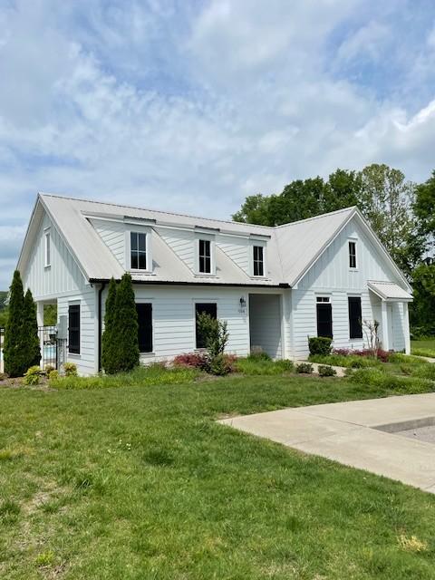 1401 Walker Way, Columbia, TN 38401 - view of front of house with a front lawn and board and batten siding