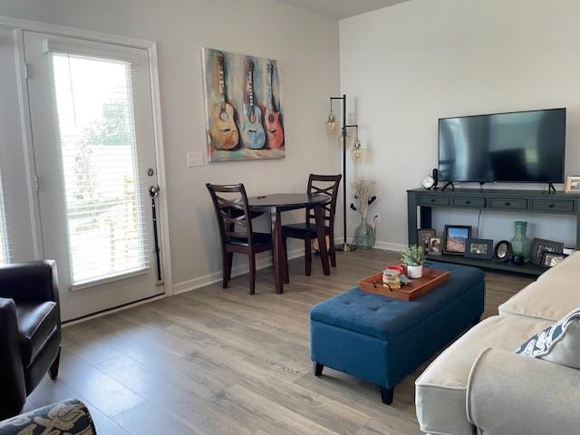 1401 Walker Way, Columbia, TN 38401 - living room with light wood-style flooring, plenty of natural light, and baseboards