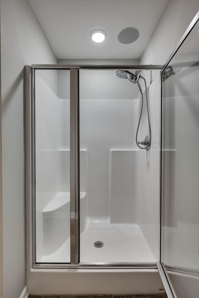 full bathroom featuring a stall shower
