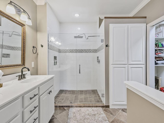 2050 Morrison Ave, Spring Hill, TN 37174 - full bathroom featuring a stall shower, vanity, a closet, tile patterned floors, and crown molding