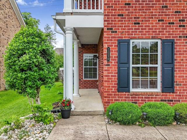 2050 Morrison Ave, Spring Hill, TN 37174 - view of exterior entry featuring a balcony and brick siding