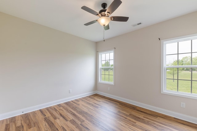 258 Jesse Dr, Pleasant View, TN 37146 - unfurnished room with wood finished floors, baseboards, and a ceiling fan