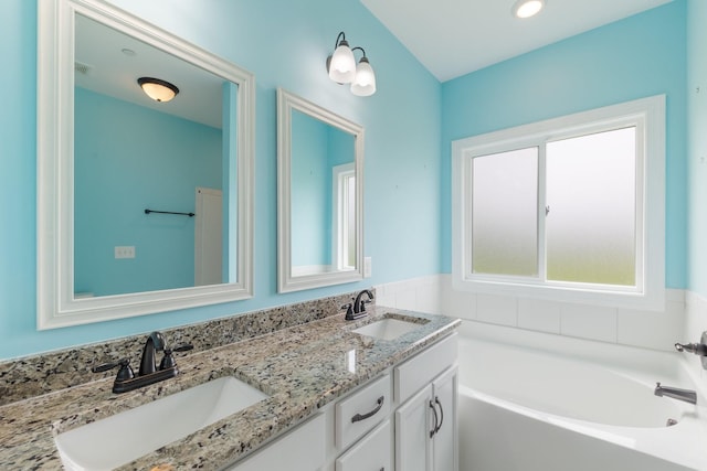 258 Jesse Dr, Pleasant View, TN 37146 - bathroom featuring a garden tub and double vanity